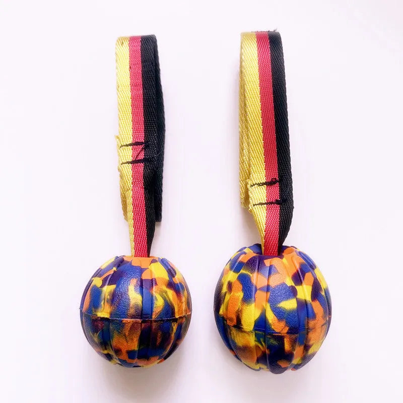 EVA floating knot ball for dog water training in camouflage and yellow colours with tether attachment