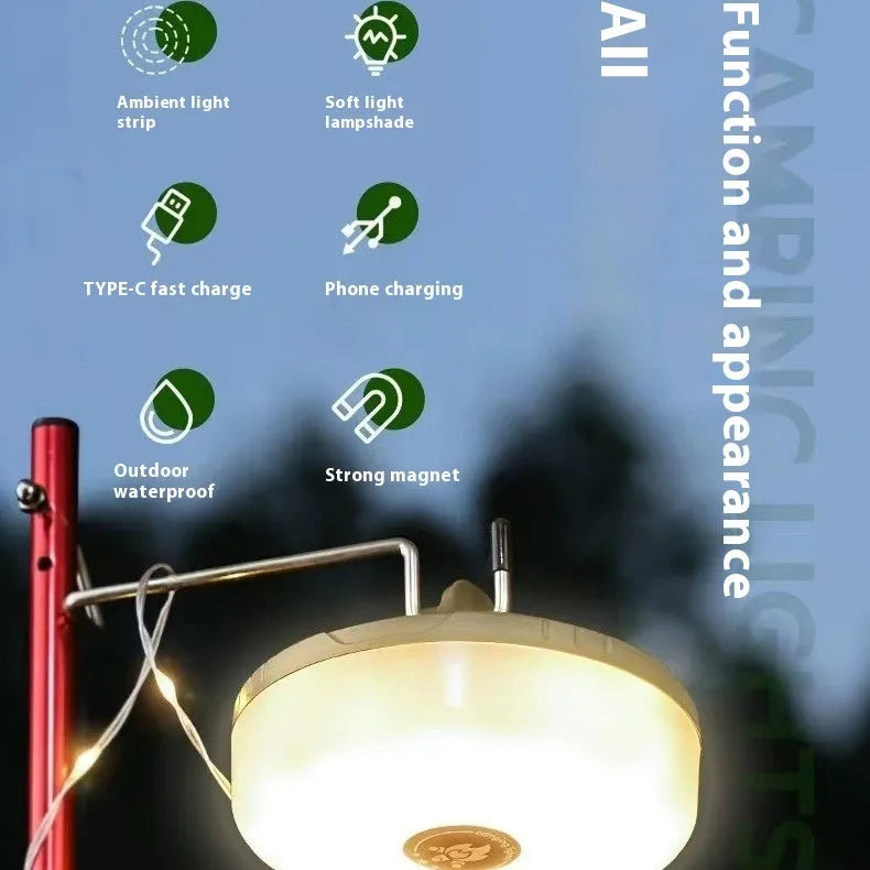Charging multifunctional camping lantern with warm and colourful light modes on a campsite table