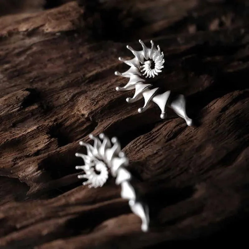 Conch colour three-dimensional matte alloy stud earrings with irregular geometric design