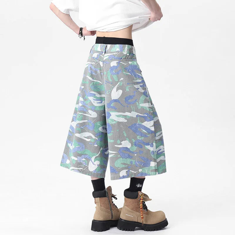 Camouflage pattern cotton cropped cargo trousers on a hanger, showing straight leg and pocket detail.
