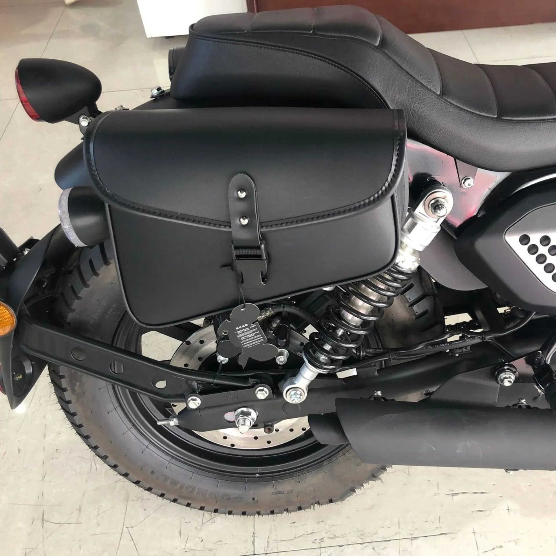 Black PU leather motorcycle swingarm saddlebag mounted on Sportster