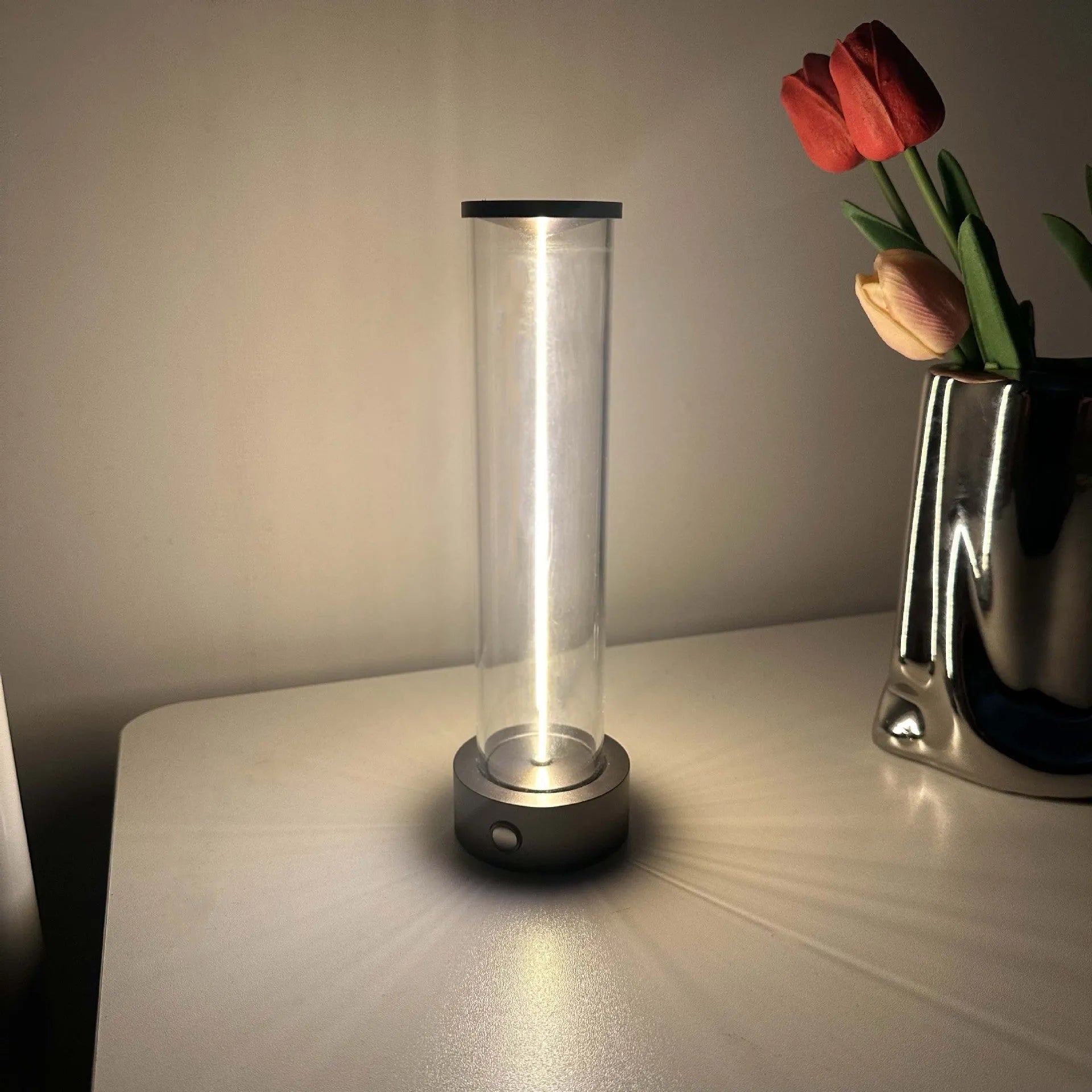Slim warm white LED light strip with magnetic base for USB charging and attachment to metal surfaces.