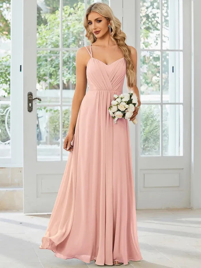 Women's sleeveless long pleated dress in an A-line silhouette, shown in a solid colour.