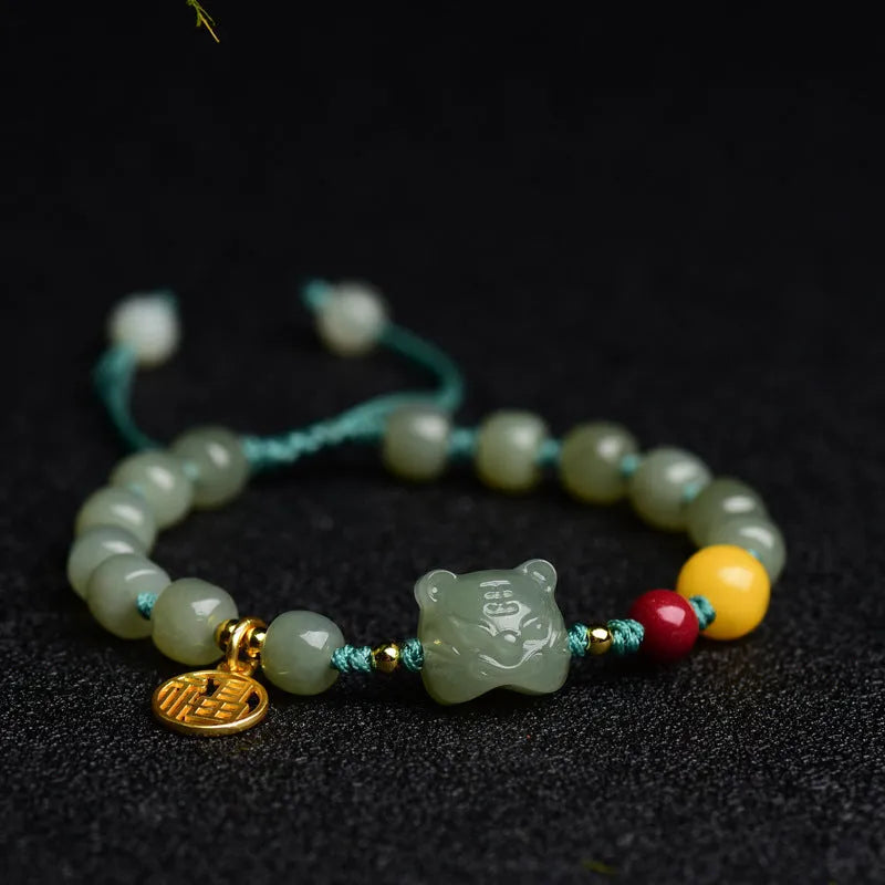 Natural Hetian Jade bracelet with cinnabar and beeswax beads, animal zodiac motifs, and sequin details on a string