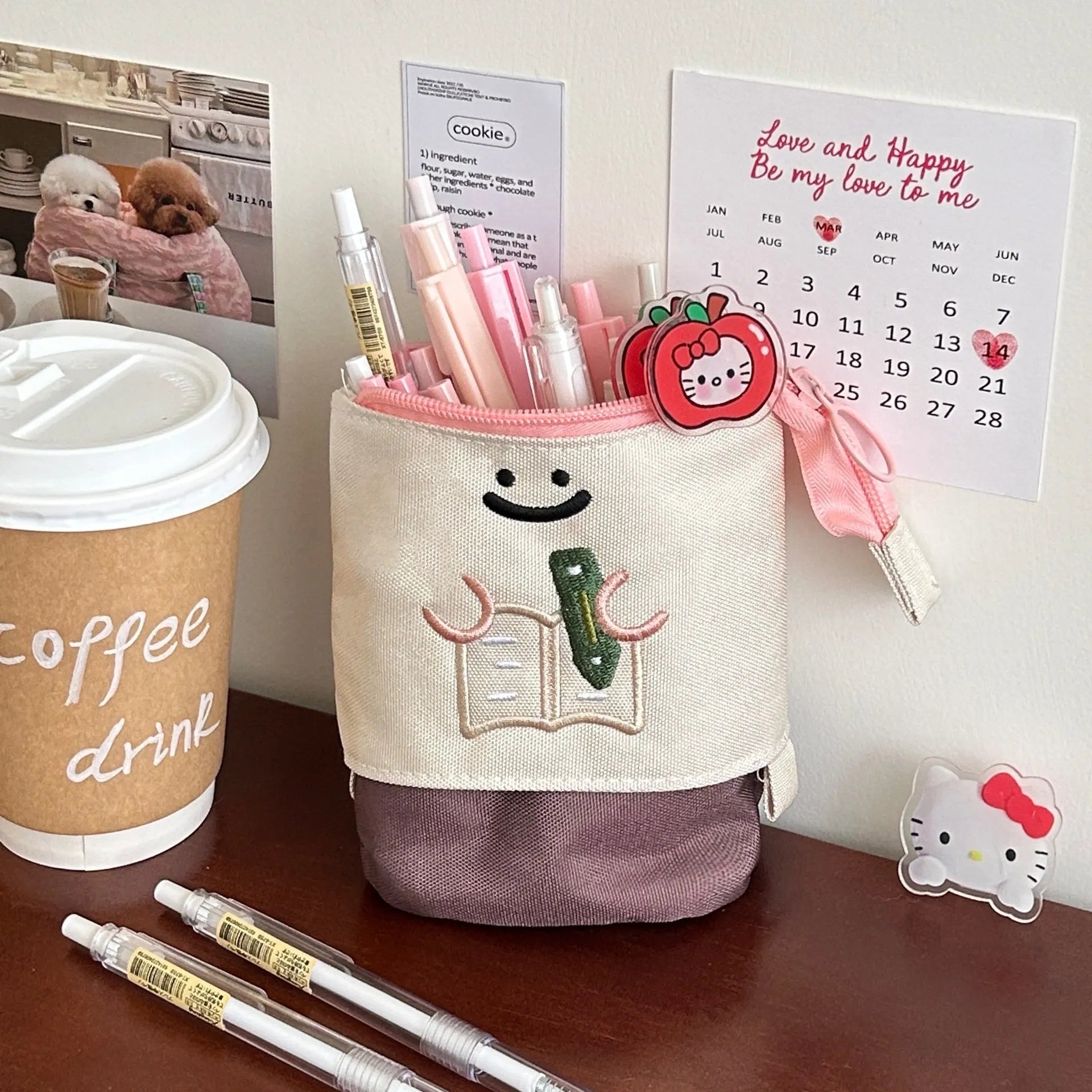 Brown collapsible Oxford fabric pencil case with zip, shown next to green version, measuring 17 by 14 cm.