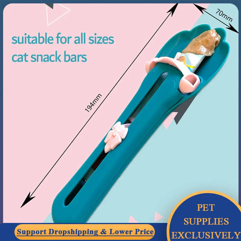 Green and pink silicone pet food spoon with squeezer function for dispensing treats and liquid food to cats and dogs