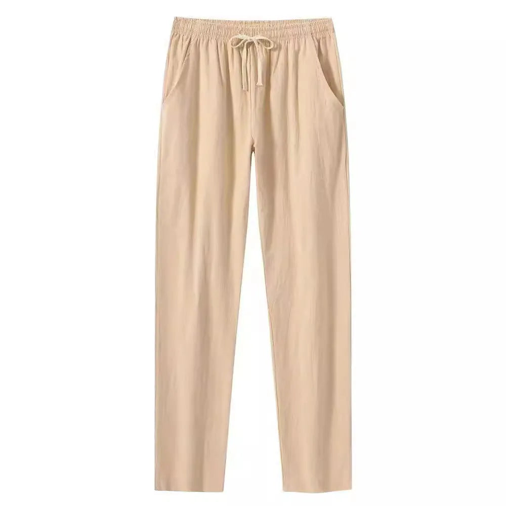 Men's loose-fitting cotton linen casual trousers in khaki colour on a neutral background.