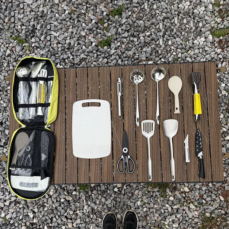 12-piece stainless steel picnic kitchenware set with khaki storage bag open to show utensils
