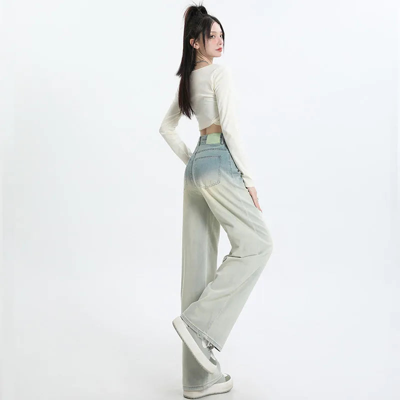 Women's gradient blue straight-leg denim trousers with wide leg fit on hanger