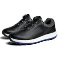 Men's low top white golf sneakers with breathable holes and a broken nail pattern sole.