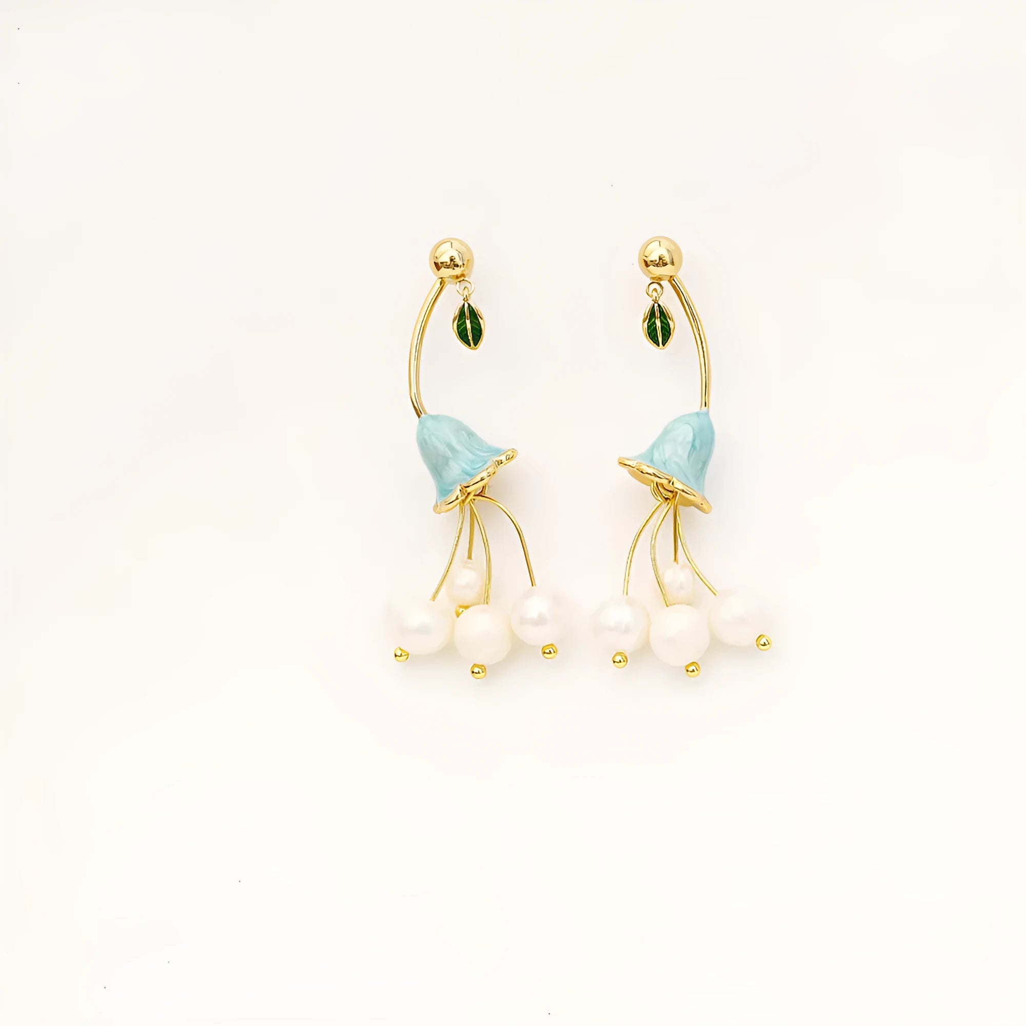 Natural baroque pearl ear studs with 14K real gold plated lily flower copper setting on white background