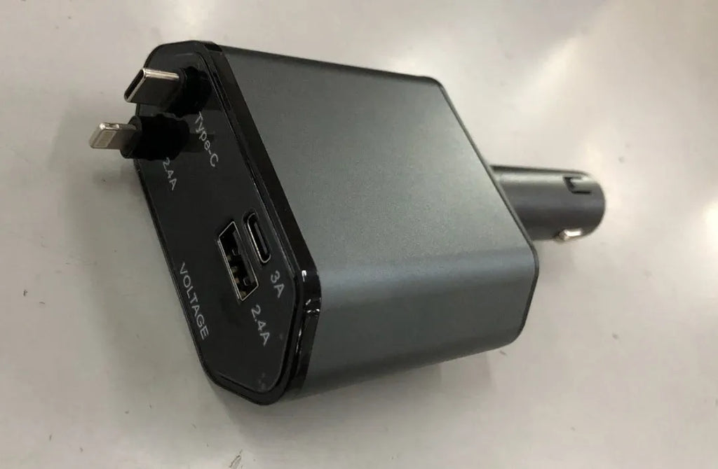 Universal car charger with retractable cable plugged into a car cigarette lighter socket.