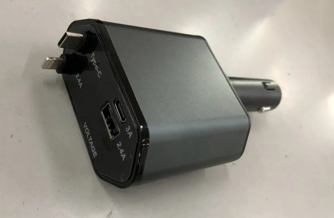 Universal car charger with retractable cable plugged into a car cigarette lighter socket.