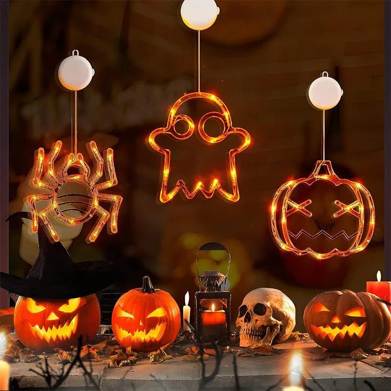 Halloween window hanging LED lights set with seven plastic decorations including spider, pumpkin, and ghost designs