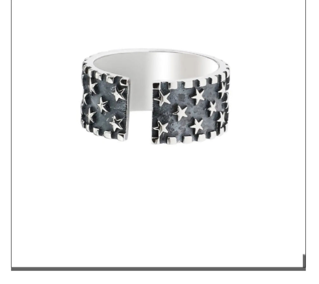 Sterling silver adjustable ring with a geometric pattern of multiple five-pointed stars.