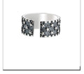 Sterling silver adjustable ring with a geometric pattern of multiple five-pointed stars.