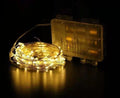 12-metre long flexible copper wire LED string light with 120 bulbs and a battery control box.