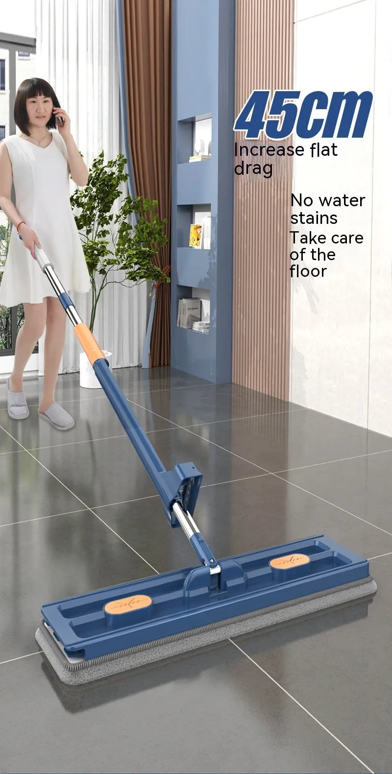 Large flat mop with long stainless steel handle and blue fine fibre cloth on hard floor