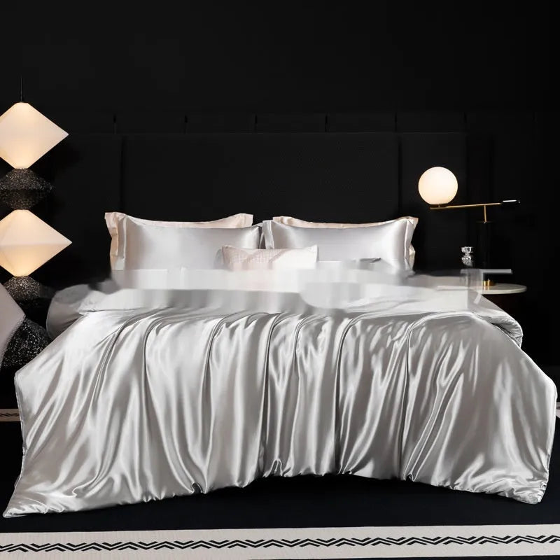 Solid colour silk bed sheet four-piece set in a modern bedroom setting, showing one of seven available colour options.