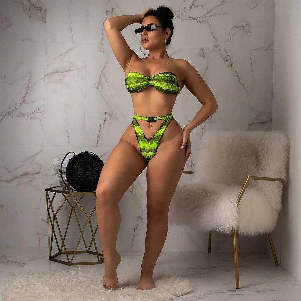 Women's snakeskin print polyester three-piece bikini suit showing long sleeve top, shorts and matching bottoms