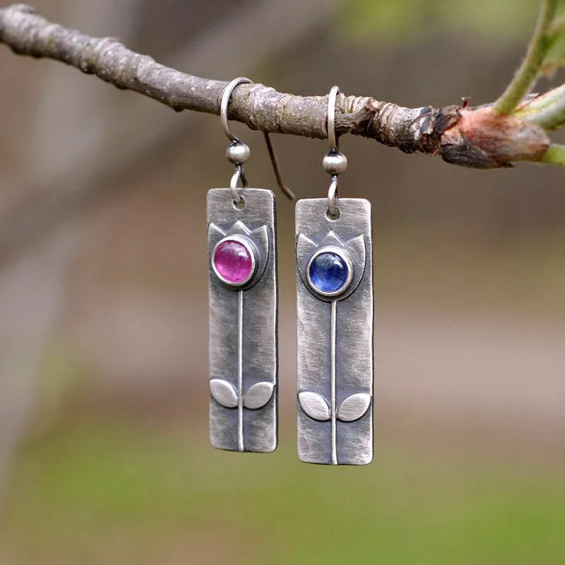 Antique finish red sapphire geometric earrings with ellipse elements and electroplated metal construction