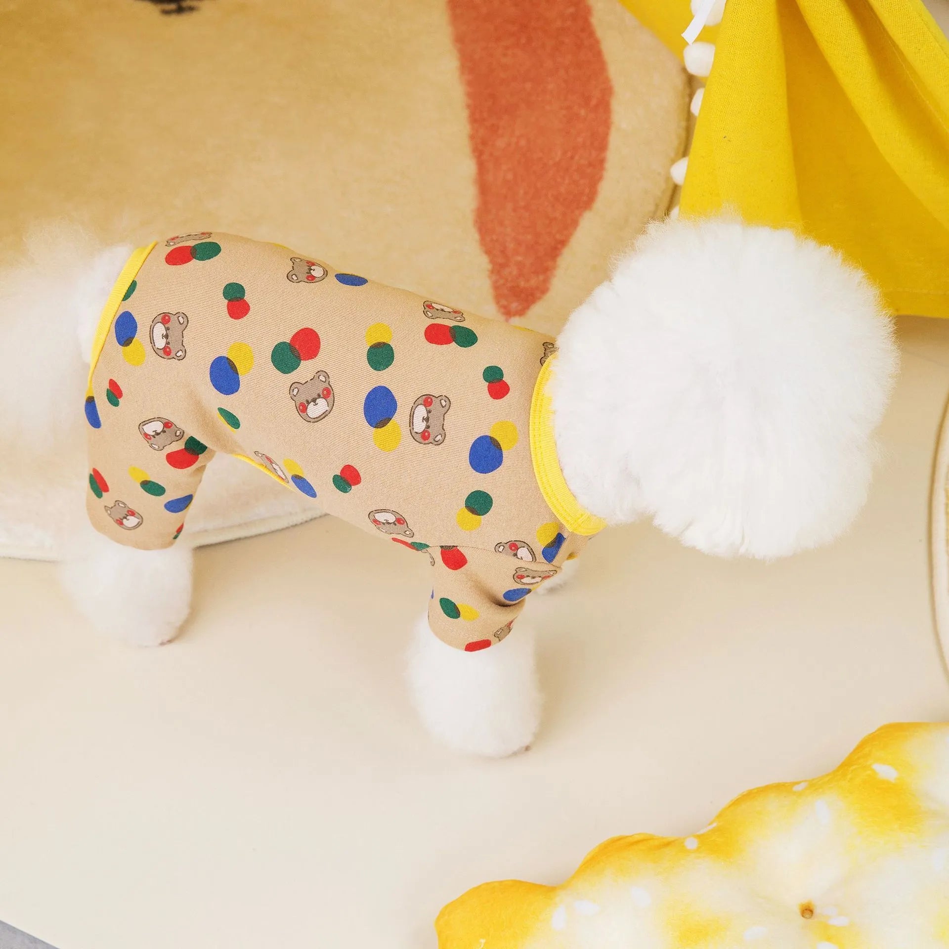 Dog wearing colourful ball bear costume in beige cotton spandex blend fabric