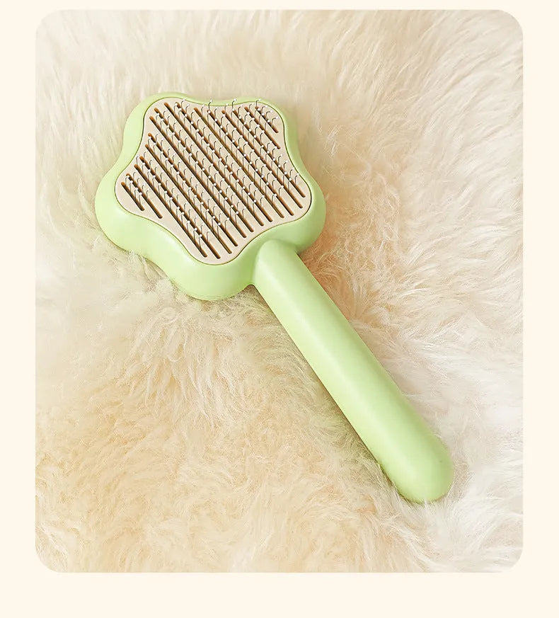Green or yellow self-cleaning stainless steel cat comb measuring 20cm long
