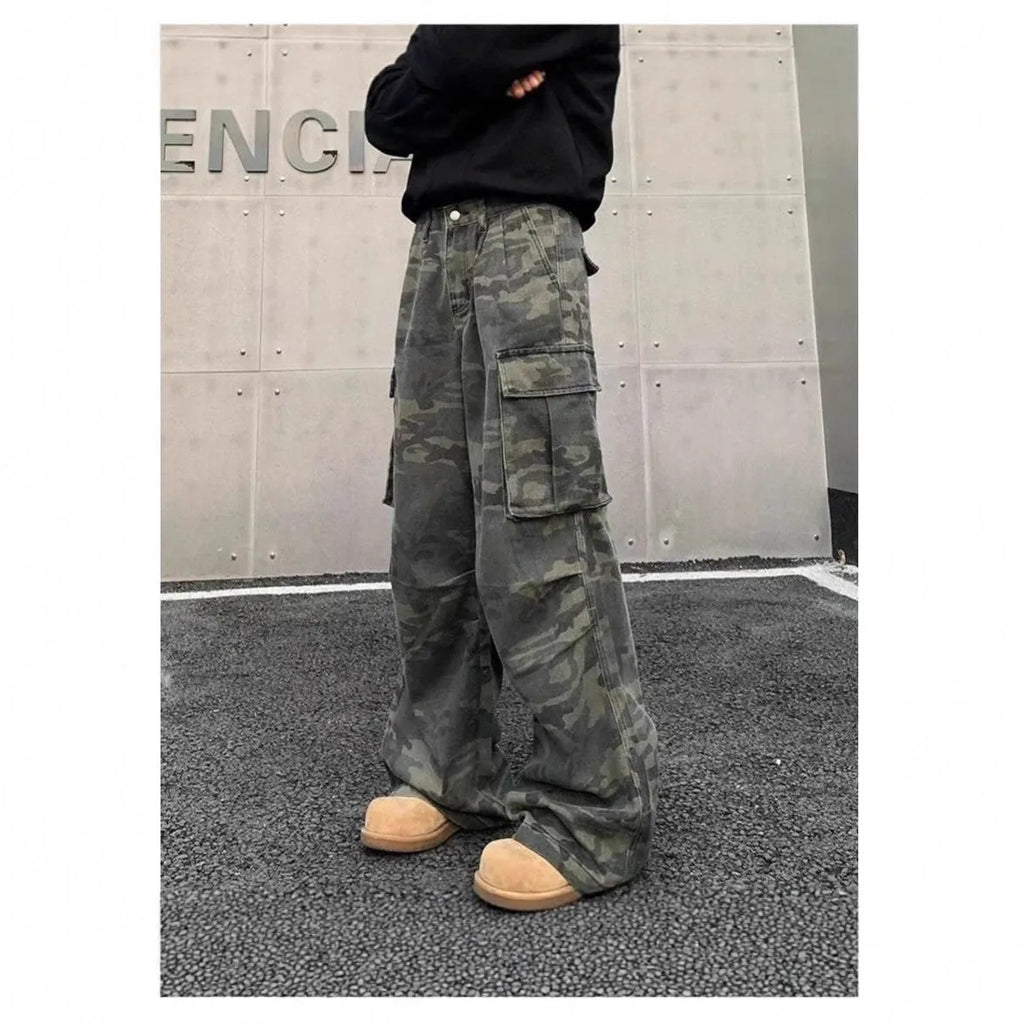 Men's washed camouflage cargo trousers with multiple pockets showing cotton blend fabric