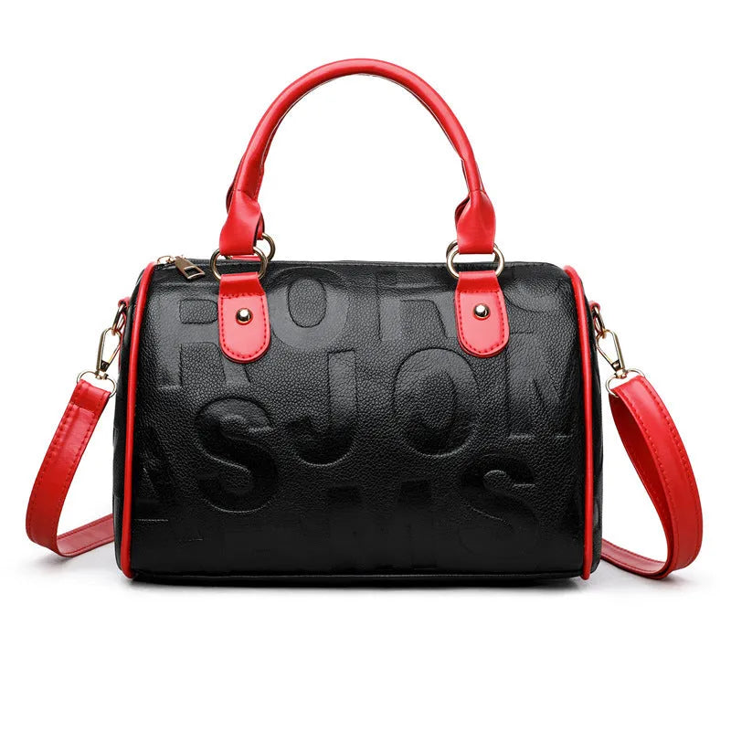 Cylindrical brown PU crossbody bag with three shoulder straps showing textured interior lining