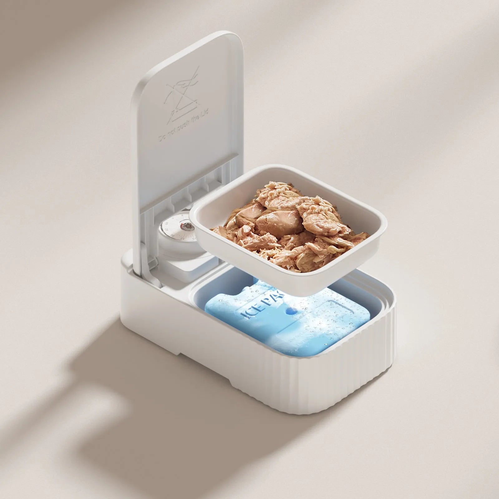White pet automatic feeder with timer display and removable ice crystal cooling box underneath.