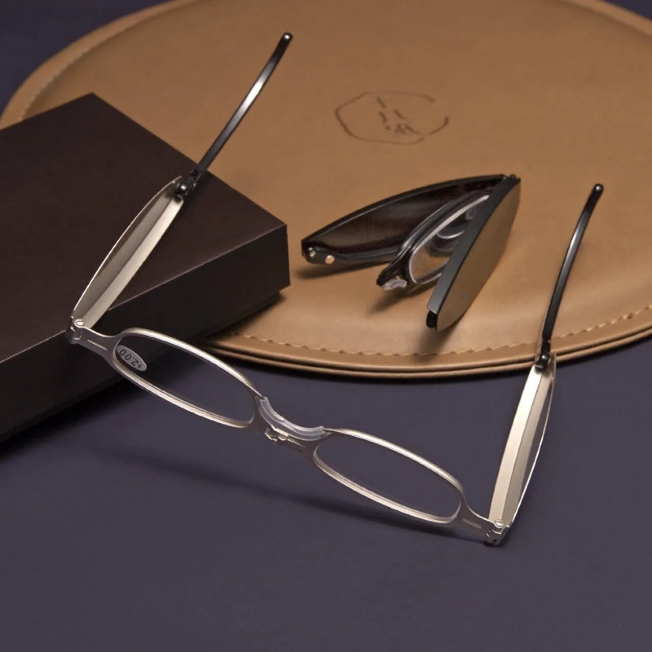 Folding presbyopic glasses in black retro frame showing folded and unfolded positions