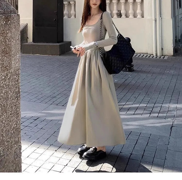 Black square collar long sleeve knitted dress with elastic waist and A-line skirt.