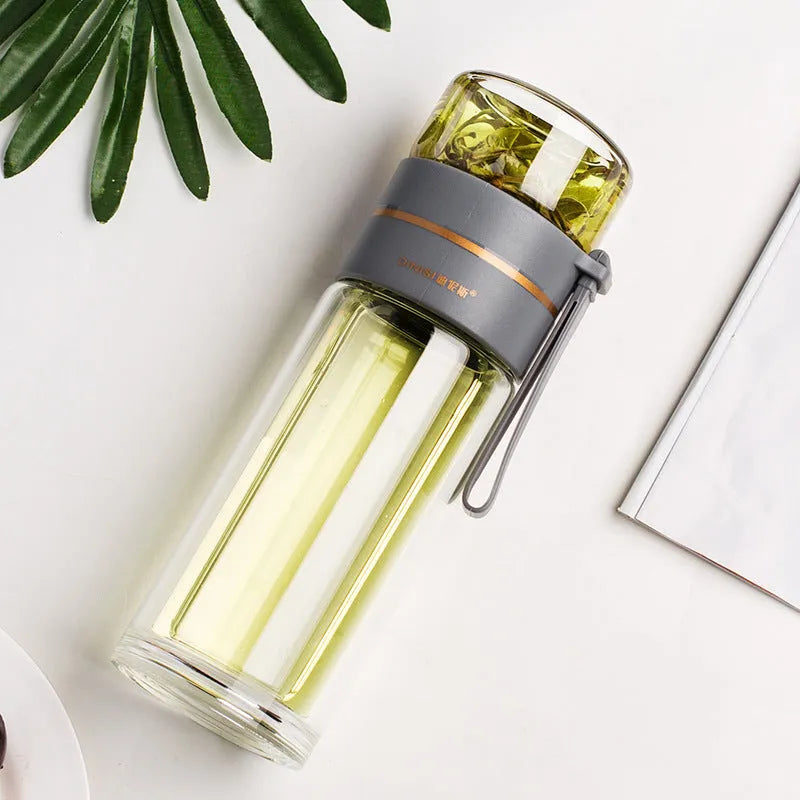Double wall glass tea infusion bottle with stainless steel filter and rope handle in various colours.