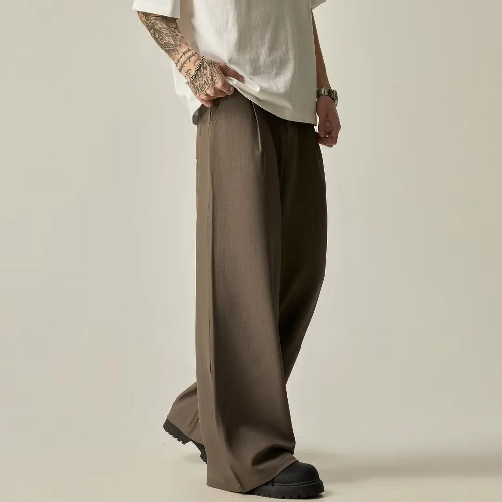 Men's solid colour wide-leg trousers with elastic waistband in black and brown options