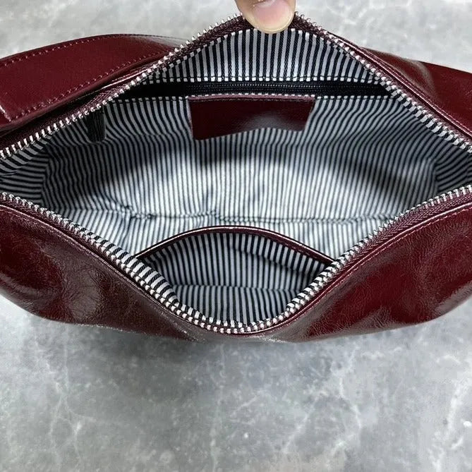 Women's oil wax leather crossbody bucket bag in anch red with zippered inner pocket, 29x18x8cm