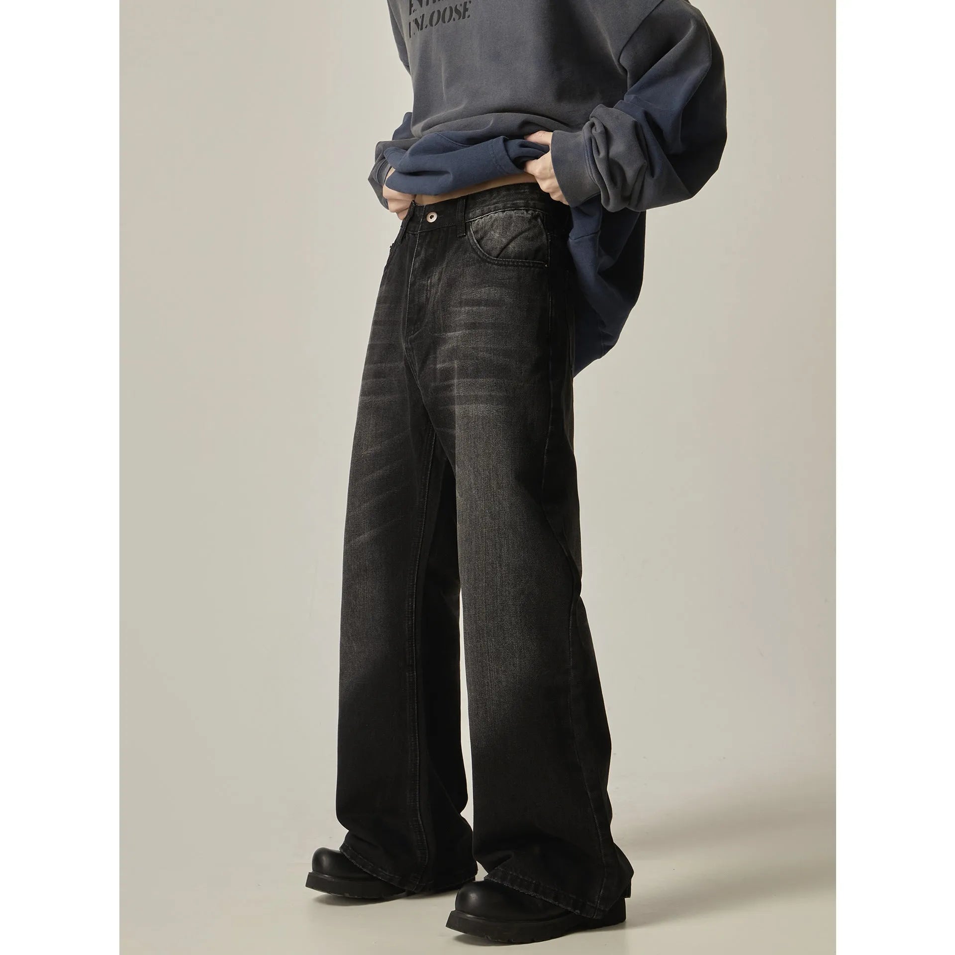 Black loose straight leg jeans with American retro styling and zipper fly front.