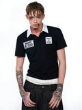Black slim fit men's short sleeve polo shirt with embroidery hat detail on the chest.