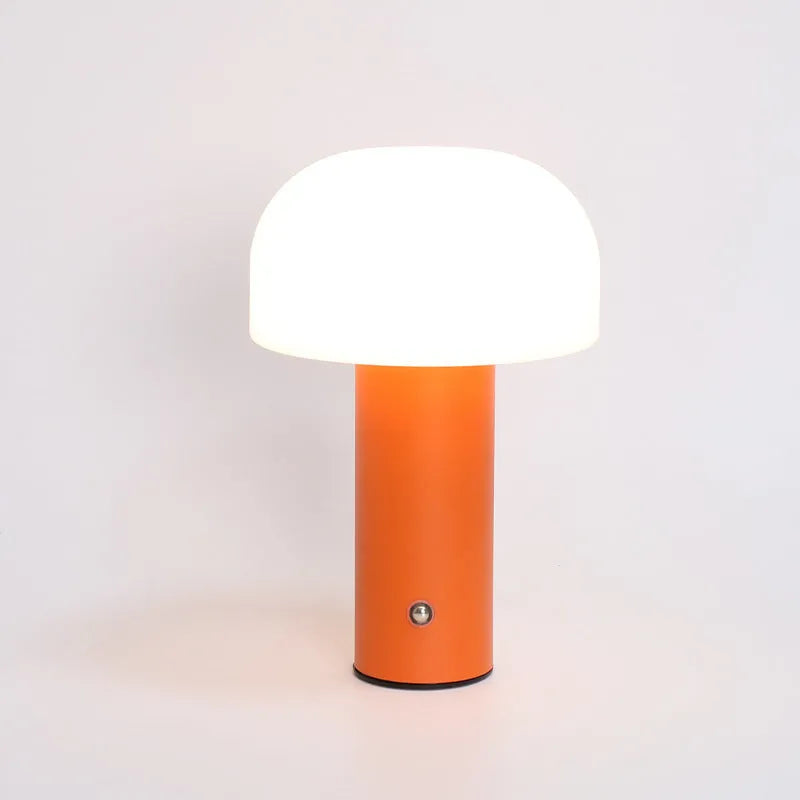 USB-powered plastic table lamp with three-colour LED effects in black, white, orange, or green finishes