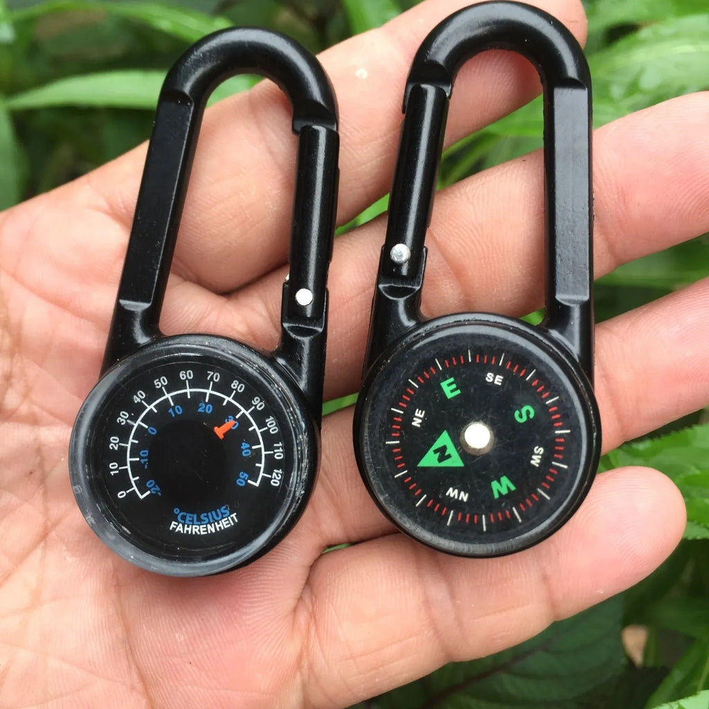 Black zinc alloy outdoor carabiner with integrated compass and thermometer display.