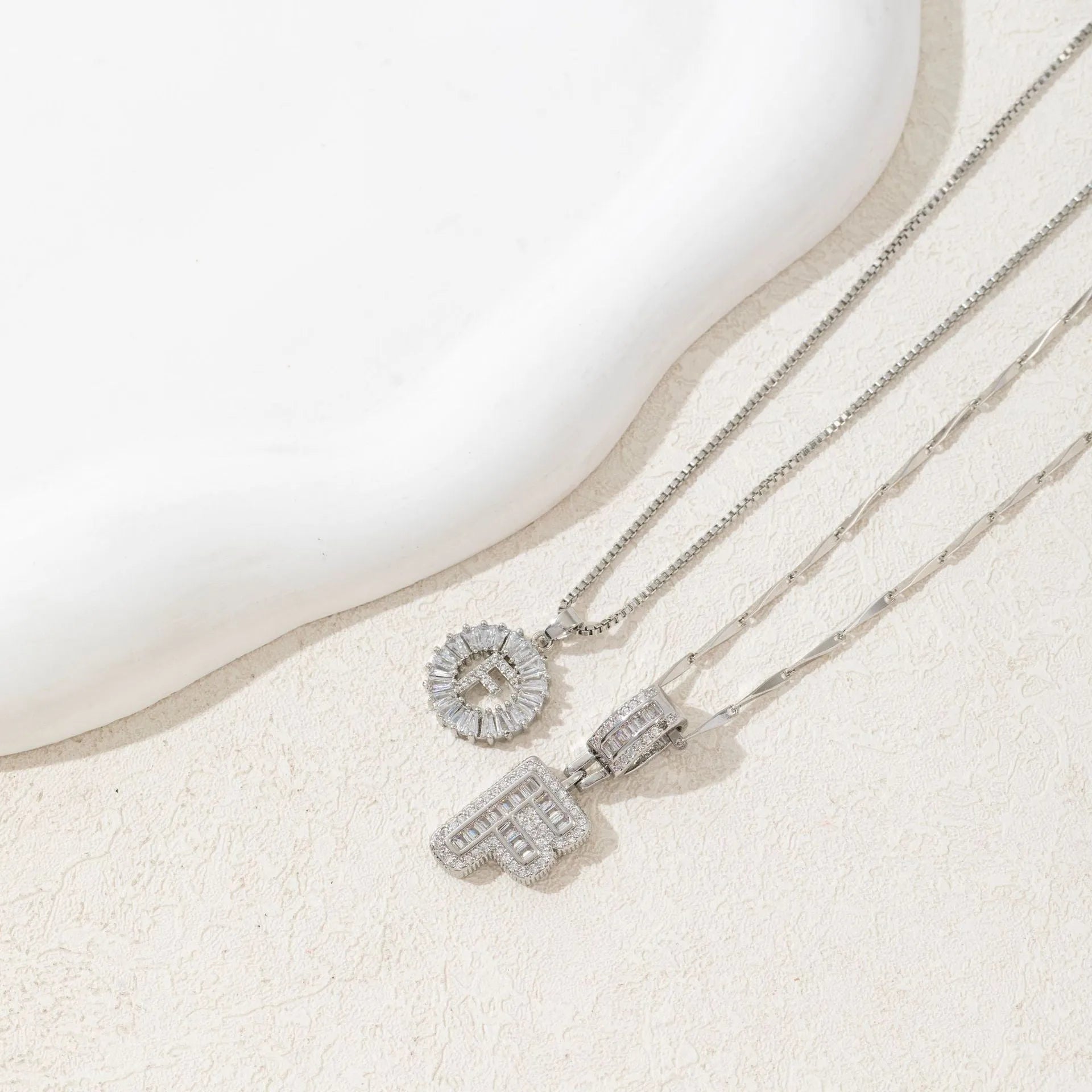 18K gold plated copper alphabet pendant necklace letter A with melon seeds chain on white background
