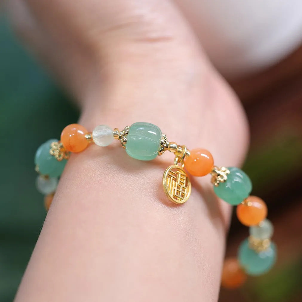 Duobao pumpkin bracelet for women with Jinsi Jade barrel beads and hanging charm on 14-16.5cm wrist