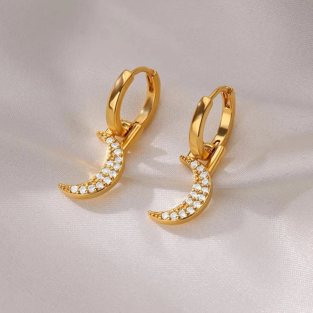 Geometric butterfly earrings with heart and star shapes in copper with diamond treatment
