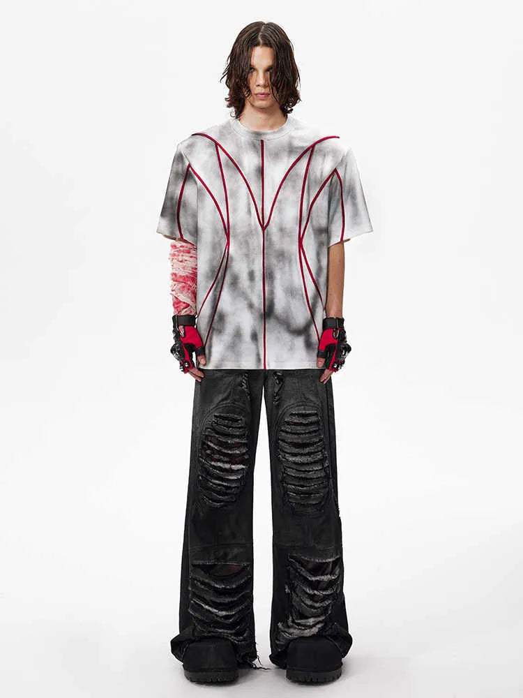 Padded shoulder short sleeve T-shirt with three-dimensional line patchwork detail on a round neck.