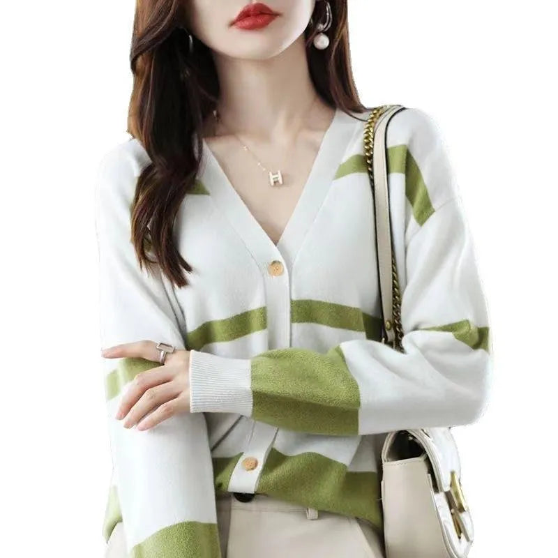 Women's striped V-neck knitted cardigan buttoned up, showcasing its slim fit and 3D pattern texture.