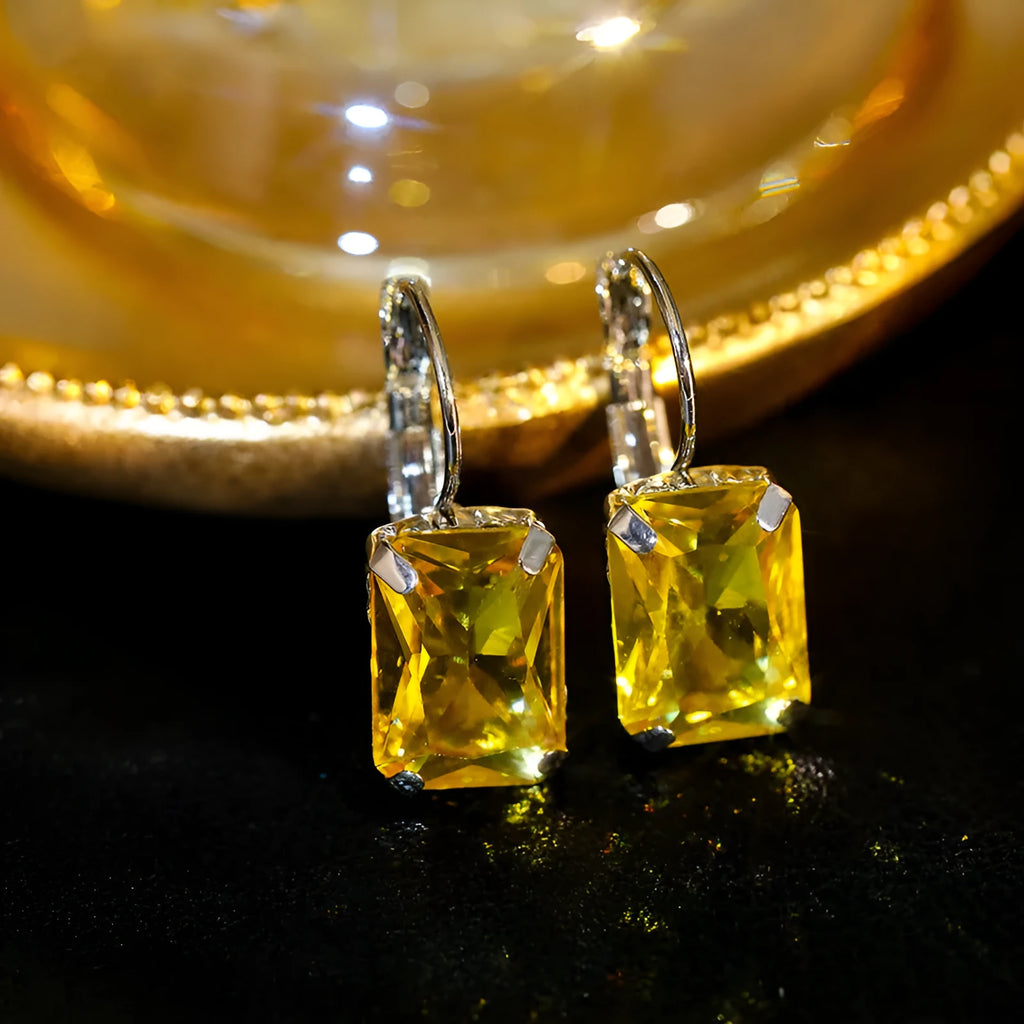 Women's square crystal earrings in red, yellow, and purple colours with copper construction