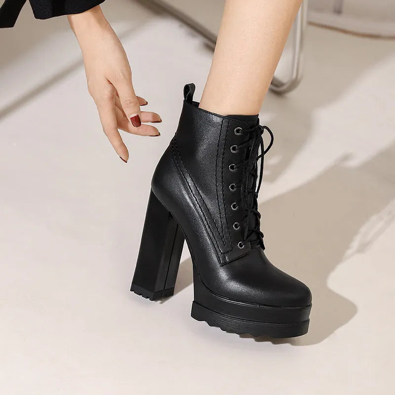 Women's black chunky heel waterproof ankle boots with a side zipper and round toe.