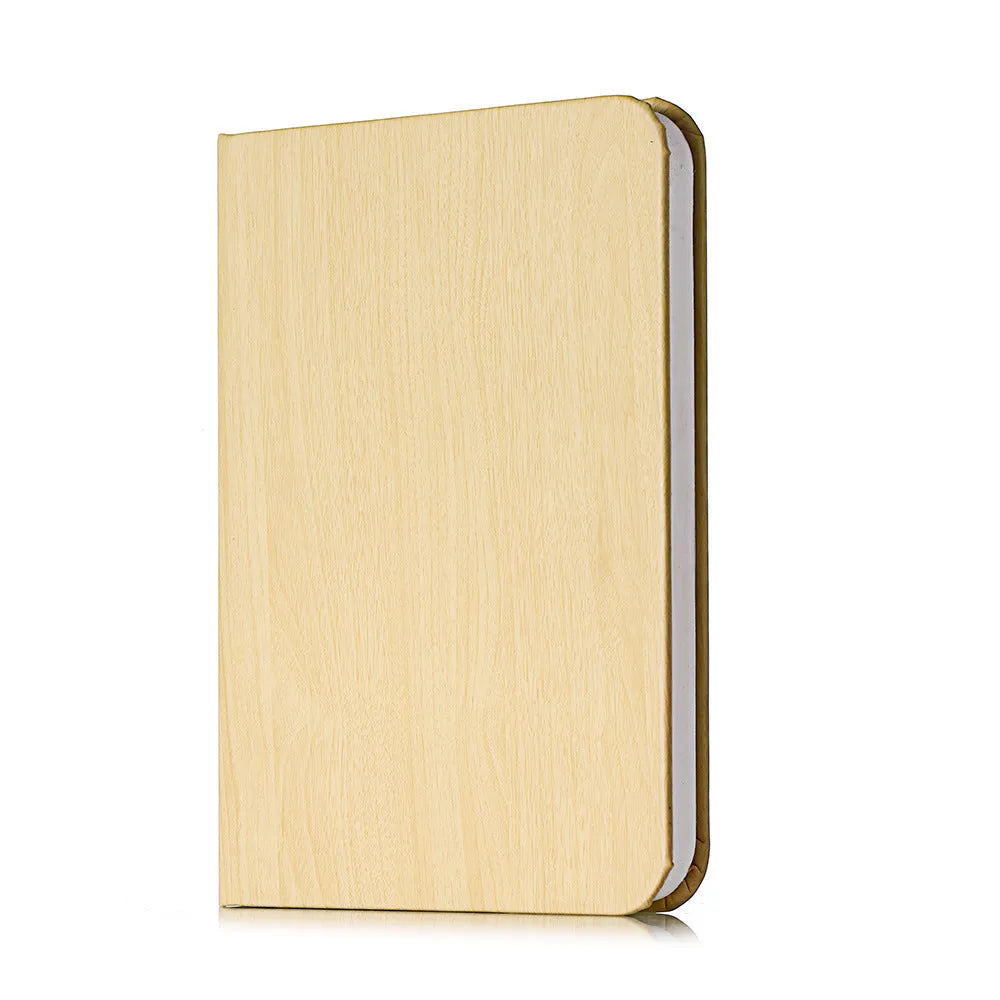 Wooden boy silhouette LED night light in modern simple style on a shelf.