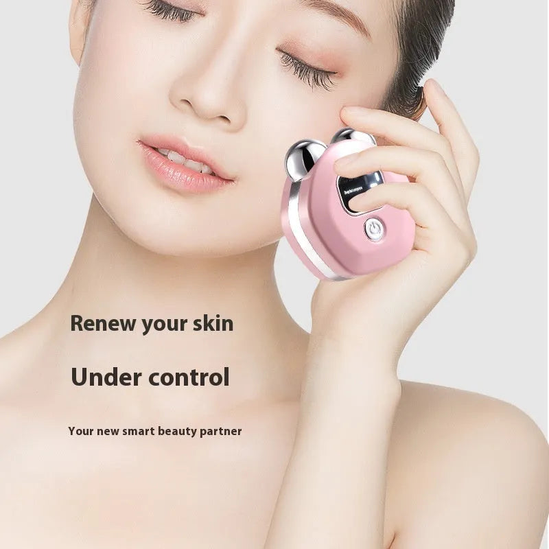 Portable white beauty instrument with double roller head for hot compress and micro current facial massage.
