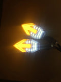 Arrow-shaped LED motorcycle turn signal indicator light with 12V connector.