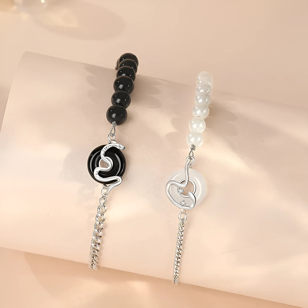 925 sterling silver couple bracelet with safety buckle, obsidian pearl, and Chinese zodiac snake design.